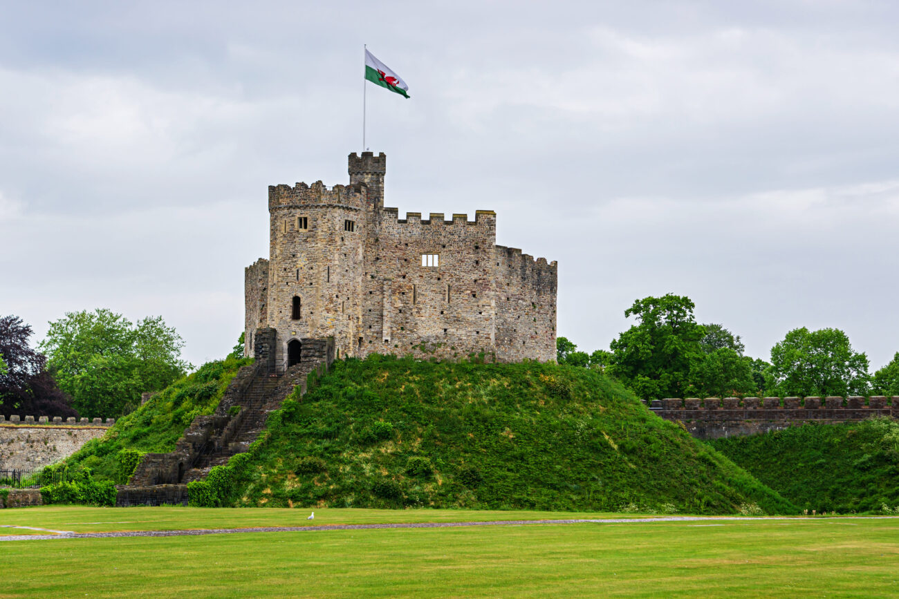 Watch tower with a flag of cardiff castle in cardiff in wales of the united kingdom. cardiff is the capital of wales.